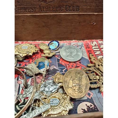 593 - Job lot of military cap badges and various vintage items; Including Churchill coin, Enid Blyton 1937... 