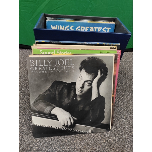 596 - 24 vinyl records in carry case with original key. Collection consists of Elton John, Genesis, Elvis,... 