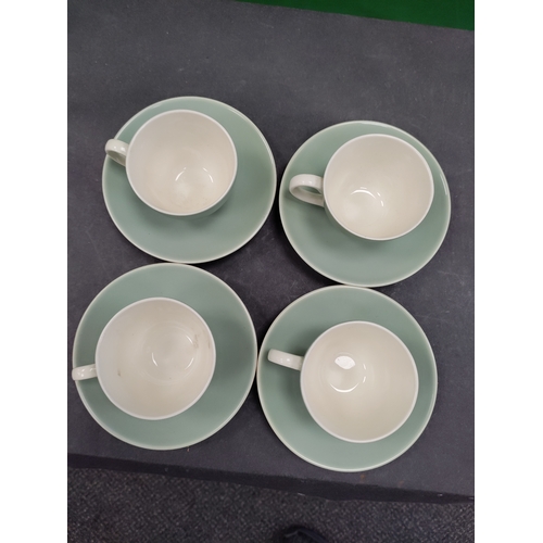 610 - Set of four light green 1960s Poole Pottery tea cups and saucers.