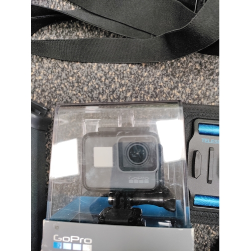 648 - Go Pro Hero 5 black, along with accessories and instruction manual.