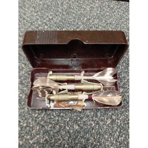 696 - Vintage unicorn brass and feather Darts, in original bakelite case, this includes spare points.