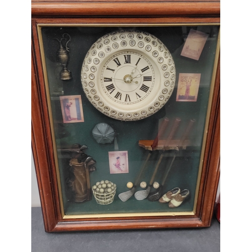 711 - A working clock with a golfing display. H 40cm x W 31cm.