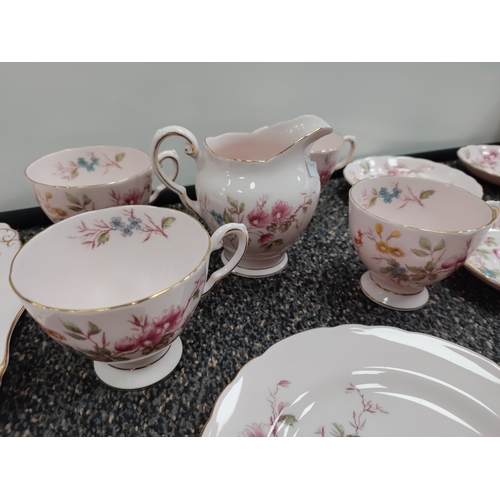 721 - A collection of pink and floral pattern Tuscan fine English bone china. Set includes 4 tea cups, 4 s... 