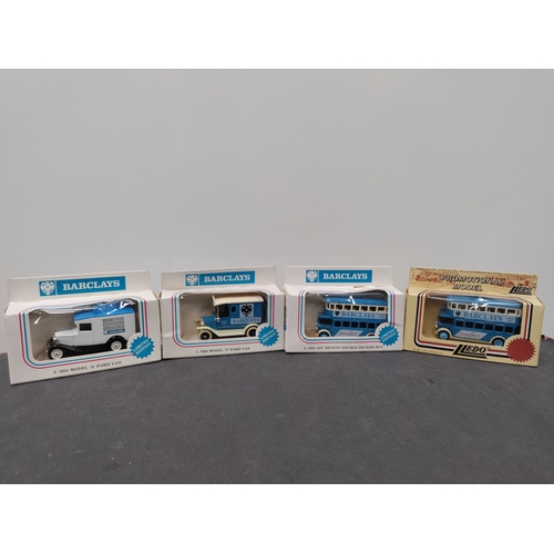 731 - A collection of 4 1980s Lledo limited edition Barclays advertising vans and buses.