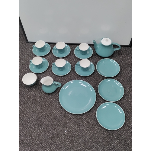 735 - A light blue Poole pottery tea set. This consists of 6 tea cups, 6 saucers, 3 side plates, a teapot,... 