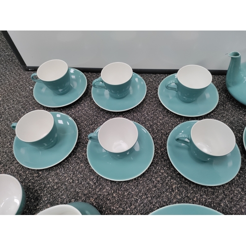 735 - A light blue Poole pottery tea set. This consists of 6 tea cups, 6 saucers, 3 side plates, a teapot,... 