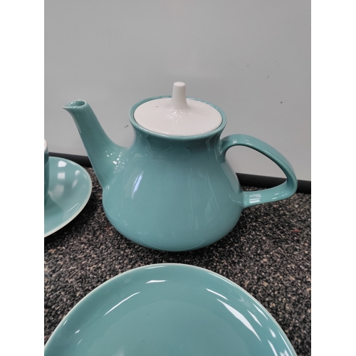 735 - A light blue Poole pottery tea set. This consists of 6 tea cups, 6 saucers, 3 side plates, a teapot,... 