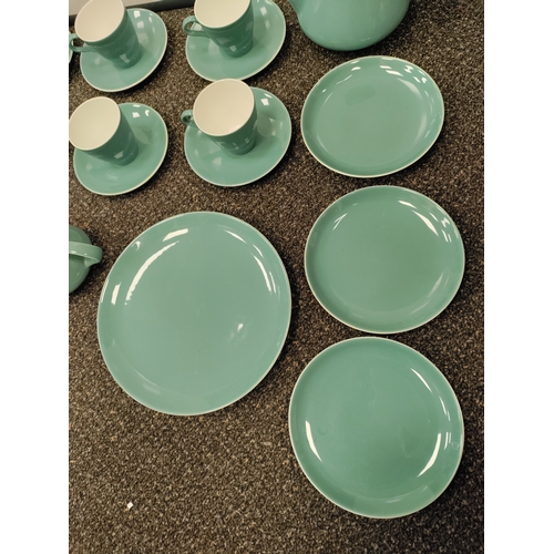 735 - A light blue Poole pottery tea set. This consists of 6 tea cups, 6 saucers, 3 side plates, a teapot,... 