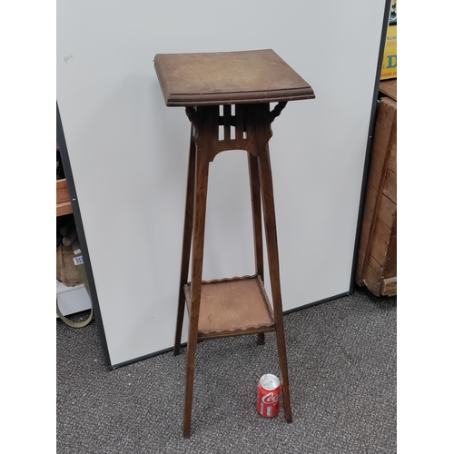 736 - A vintage oak plant stand. H 94cm x W 30cm.