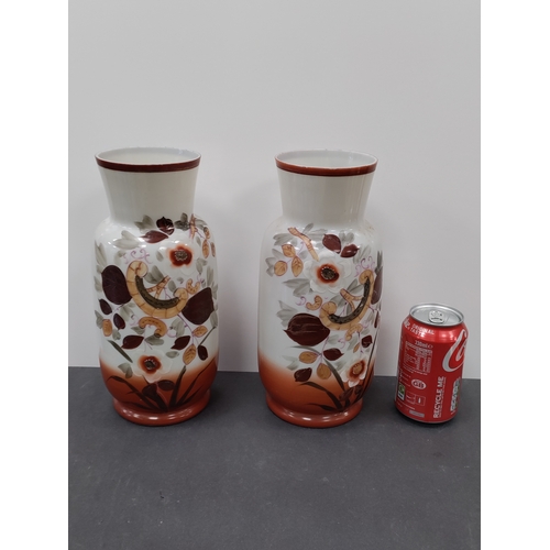 739 - A pair of floral pattern hand painted Victorian milk glass vases.