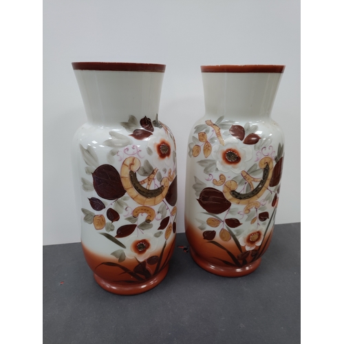 739 - A pair of floral pattern hand painted Victorian milk glass vases.