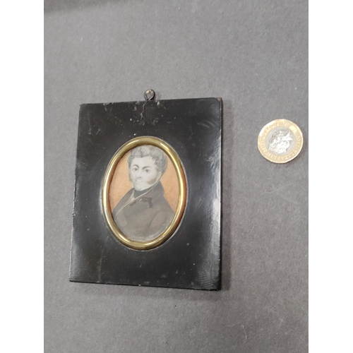 679 - A Victorian hand painted portrait of a man in a square wooden frame.