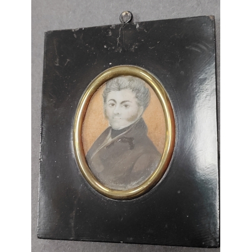 679 - A Victorian hand painted portrait of a man in a square wooden frame.