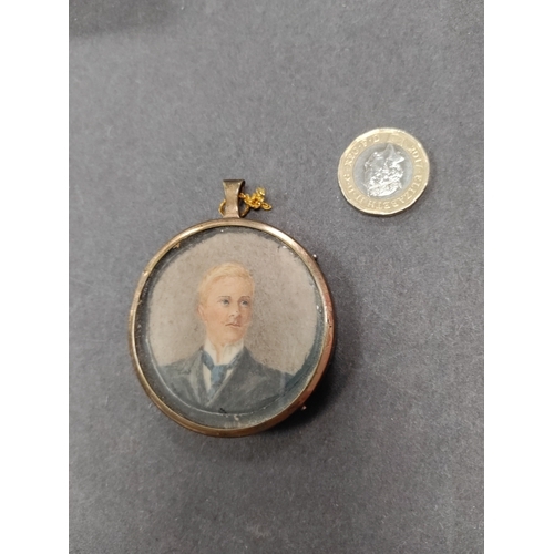 722 - An original Victorian hand painted portrait of a man in a small circular frame.