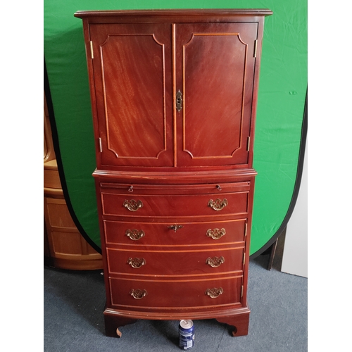 106 - A vintage TV / drinks cabinet with a pull out flap and draw fronted cupboard. Includes keys.