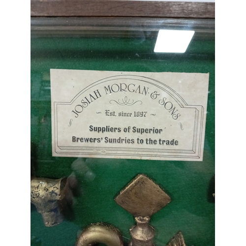 147 - A framed collection of Antique brass beer taps/spigots from Josiah Morgan & Sons. To include a large... 
