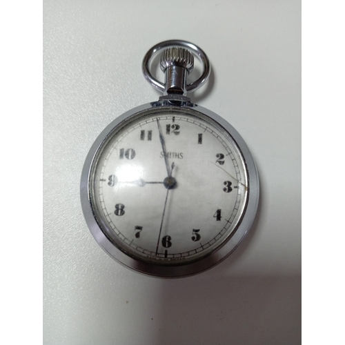 121 - A working vintage Smiths pocket watch. Small crack on face.