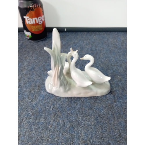 63 - A vintage NAO by Lladro Spanish ceramic group of geese.