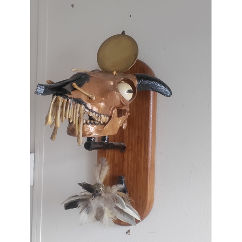 73 - A unique wall mounted taxidermy artwork by W.Hudson of a painted rams head and a chick made from fea... 