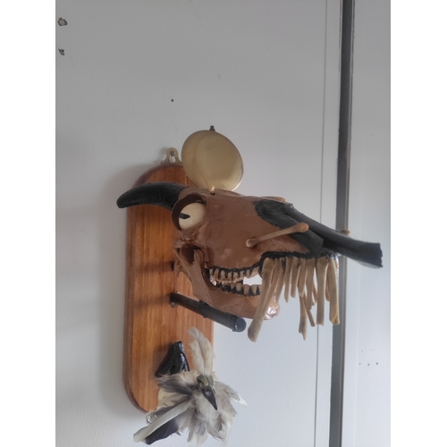 73 - A unique wall mounted taxidermy artwork by W.Hudson of a painted rams head and a chick made from fea... 