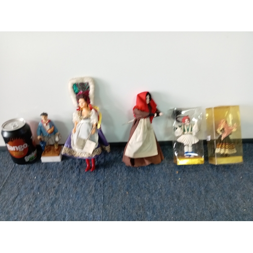 83 - A collection of vintage dolls, two porcelain costume dolls, one by Peggy Nisbet. Two Greek boxed dol... 