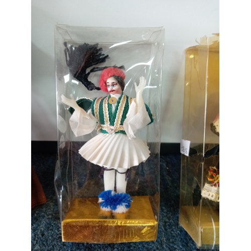 83 - A collection of vintage dolls, two porcelain costume dolls, one by Peggy Nisbet. Two Greek boxed dol... 
