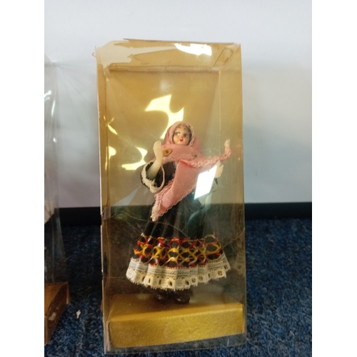 83 - A collection of vintage dolls, two porcelain costume dolls, one by Peggy Nisbet. Two Greek boxed dol... 