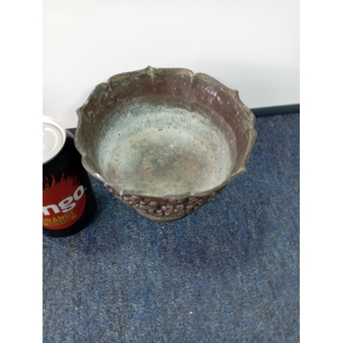 85 - An Oriental coppered bronze pedestal bowl with a blossom detail.