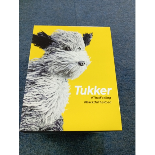 136 - A new in box AA 'tukker' dog.