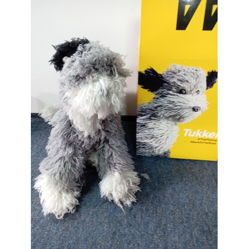 136 - A new in box AA 'tukker' dog.