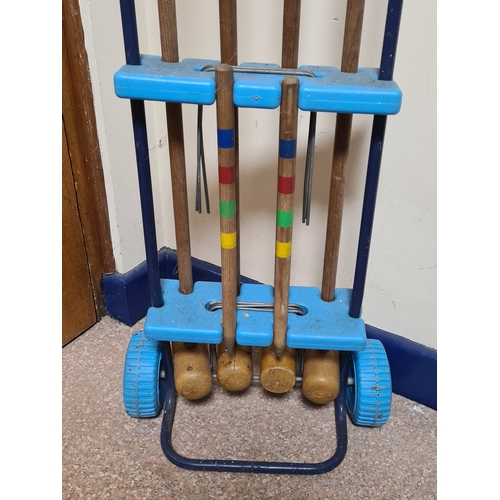 144 - Vintage 4 player garden Croquet set. Measures H86cm x W35cm x 20cm.