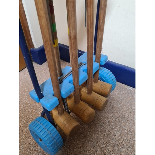 144 - Vintage 4 player garden Croquet set. Measures H86cm x W35cm x 20cm.