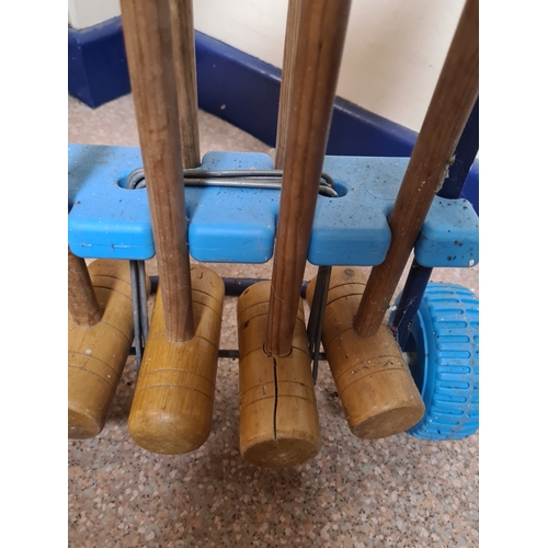 144 - Vintage 4 player garden Croquet set. Measures H86cm x W35cm x 20cm.