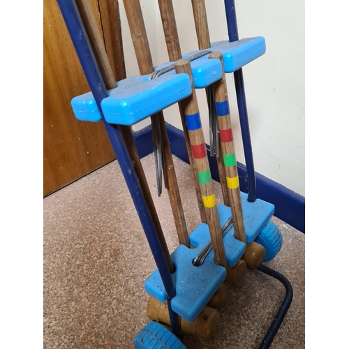 144 - Vintage 4 player garden Croquet set. Measures H86cm x W35cm x 20cm.