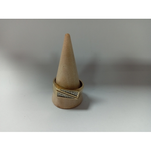 388 - A 9ct gold 0.1ct diamond pattern signet ring. Size V. Weight 4.63 grams.