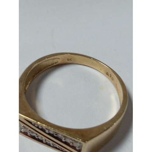 388 - A 9ct gold 0.1ct diamond pattern signet ring. Size V. Weight 4.63 grams.