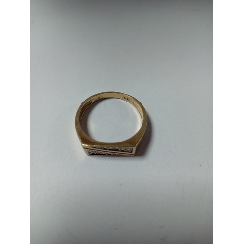 388 - A 9ct gold 0.1ct diamond pattern signet ring. Size V. Weight 4.63 grams.