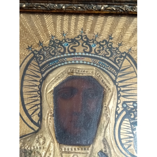 252 - An antique handpainted religious icon of The Black Madonna of Czestochowa Poland in a gold gilt fram... 