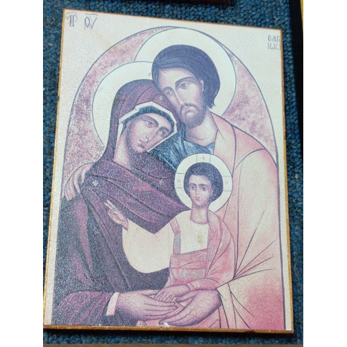 254 - A collection of 6 religious icon prints on wood one is carved.