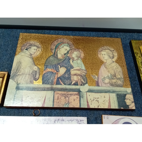 254 - A collection of 6 religious icon prints on wood one is carved.