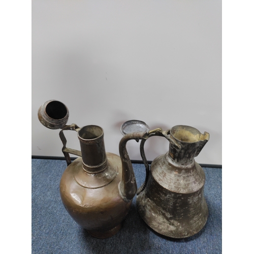 4 - A pair of vintage eastern copper jugs