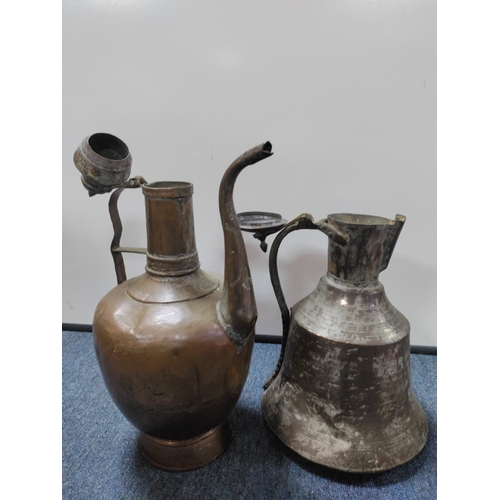 4 - A pair of vintage eastern copper jugs