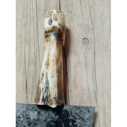 8 - An antique carved bone handled nieve trowel. H 28cm.