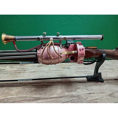 12 - A unique light up atomic gun artwork by W. Hudson. Includes stand.