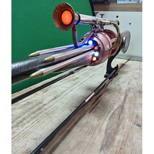 12 - A unique light up atomic gun artwork by W. Hudson. Includes stand.