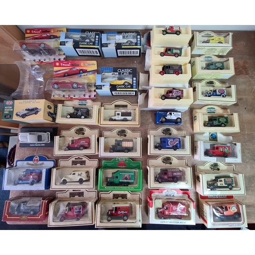 178 - A large collection of 33 Diecast Model Vans and Cars, all with packaging.
Mainly advertising vans su... 