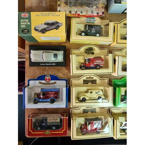 178 - A large collection of 33 Diecast Model Vans and Cars, all with packaging.
Mainly advertising vans su... 
