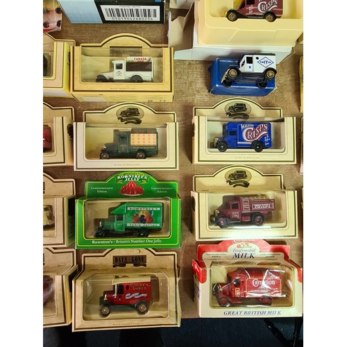 178 - A large collection of 33 Diecast Model Vans and Cars, all with packaging.
Mainly advertising vans su... 