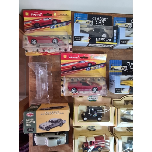 178 - A large collection of 33 Diecast Model Vans and Cars, all with packaging.
Mainly advertising vans su... 
