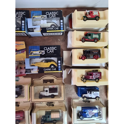 178 - A large collection of 33 Diecast Model Vans and Cars, all with packaging.
Mainly advertising vans su... 